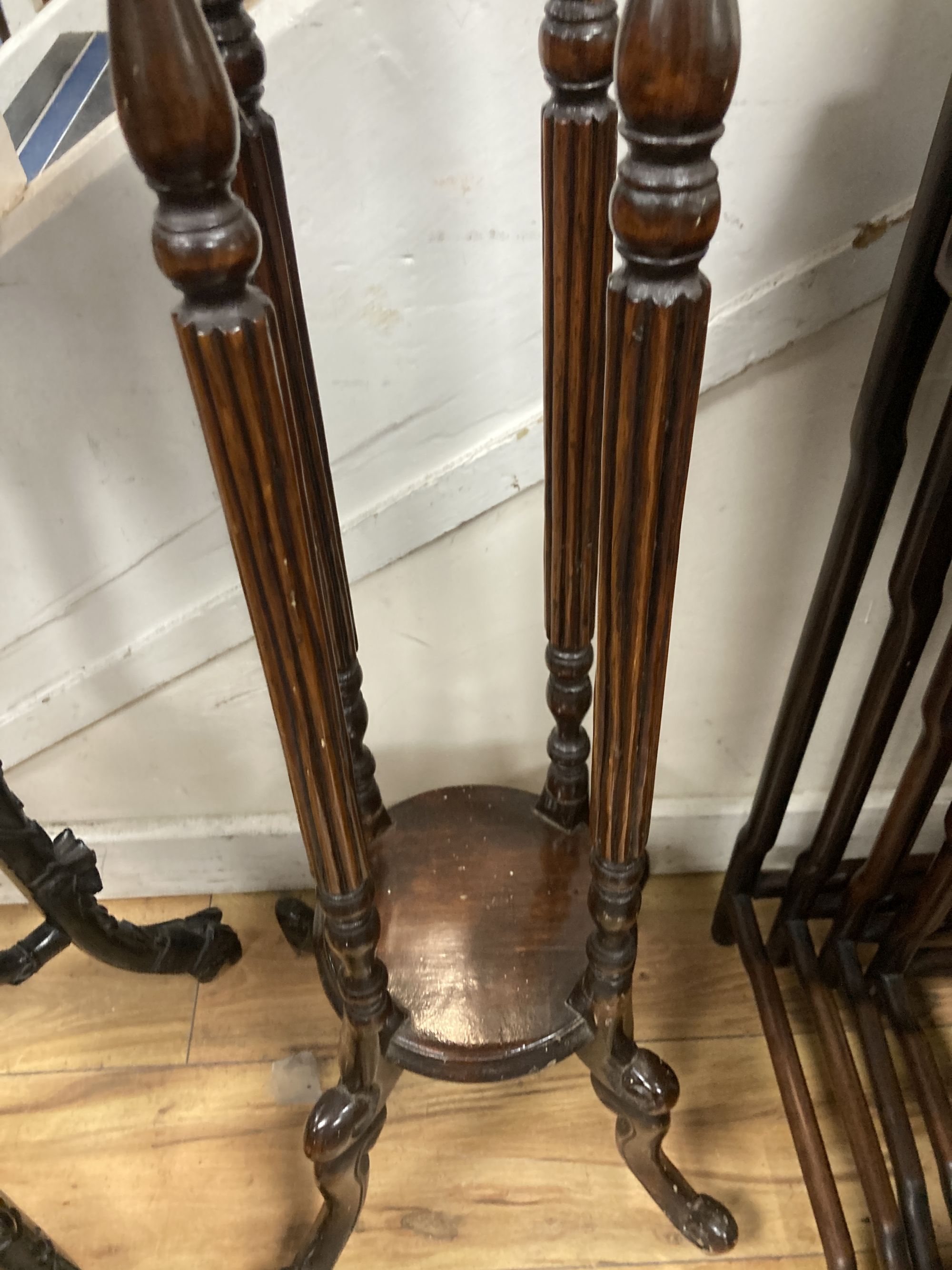 A mahogany two tier jardiniere stand, diameter 28cm height 100cm